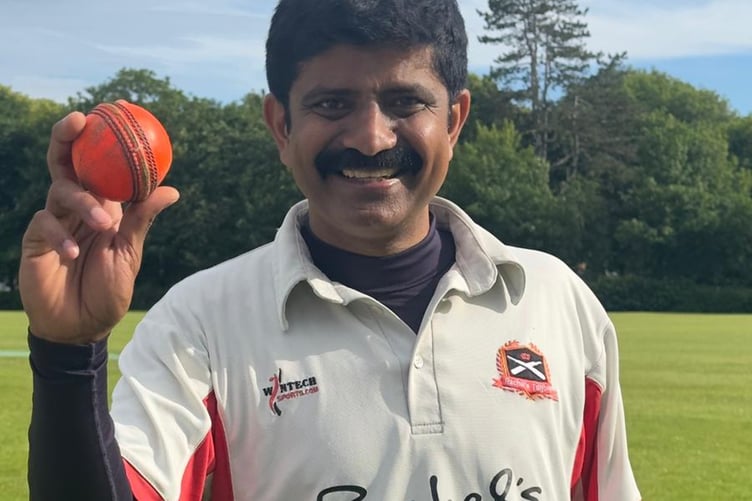 Pace bowler Milton John proudly displays the match ball