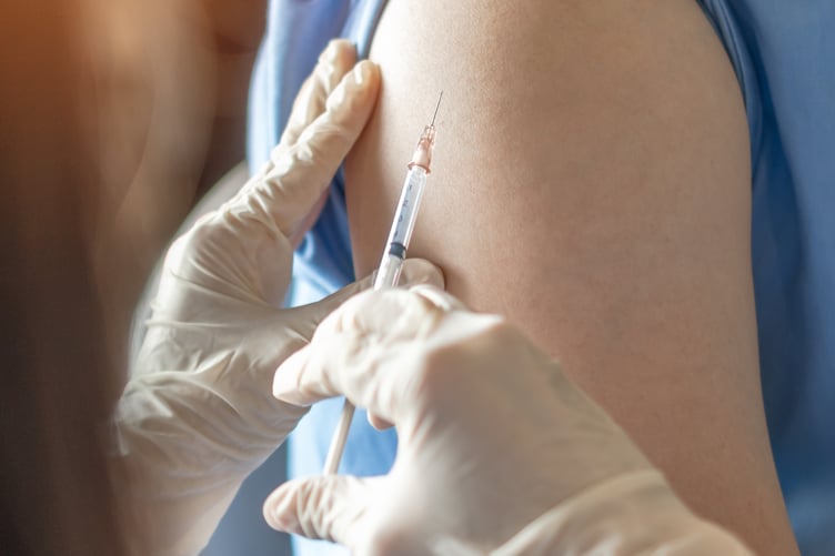 Vaccination being administered
