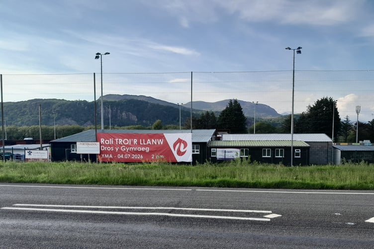 A photograph of the banner displayed along the football ground fence