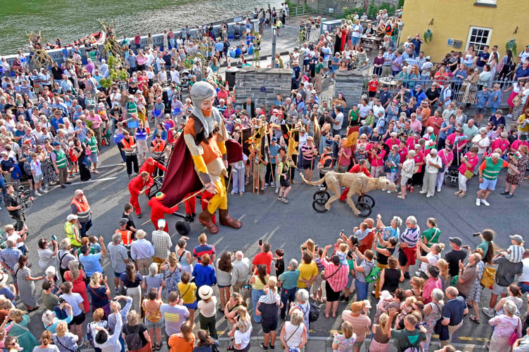 Hundreds look on as Lord Rhys and his dog Teifi make thier way to Cardigan Castle