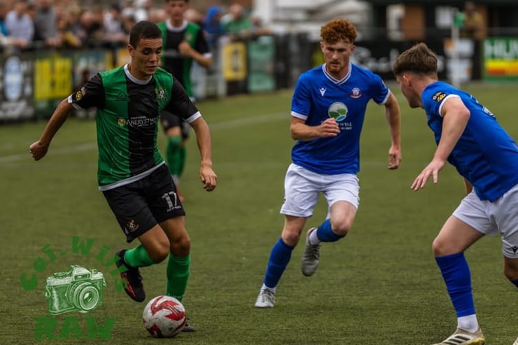 Rhys Hughes leads an Aberystwyth attack against Caersws