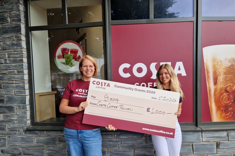 Costa Coffee present Gisda with a cheque for £1,000
