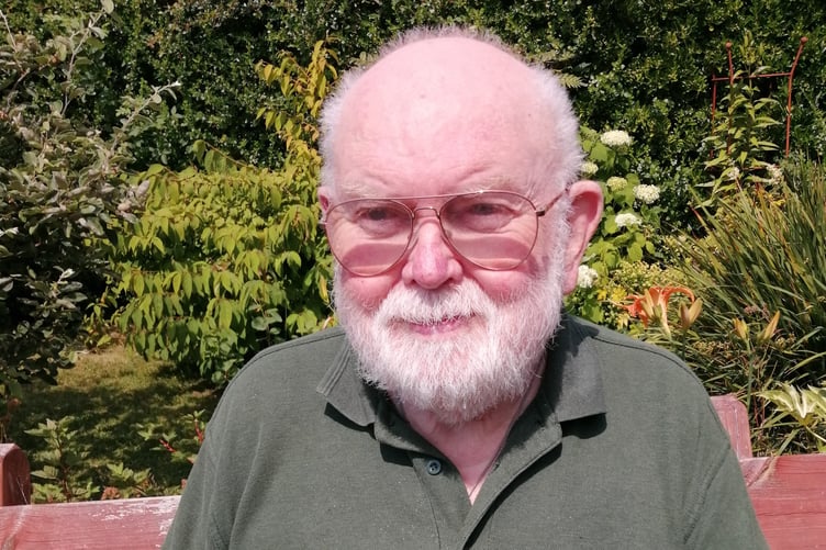 David Shepherd was forced to wait in traffic in the back of an ambulance during a cycling race through Aberystwyth.