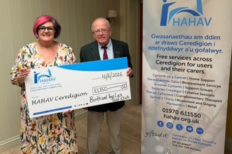 President Mike presenting cheque to Rhian Dafydd from HaHav