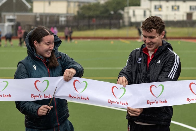 The ribbon was officially cut by Evie Holt, a member of staff at Byw’n Iach Bro Dysynni, who plays for Wrexham Women’s team and has represented Wales at Under-17 level, and by John Bennett, who plays for the Wales hockey team.