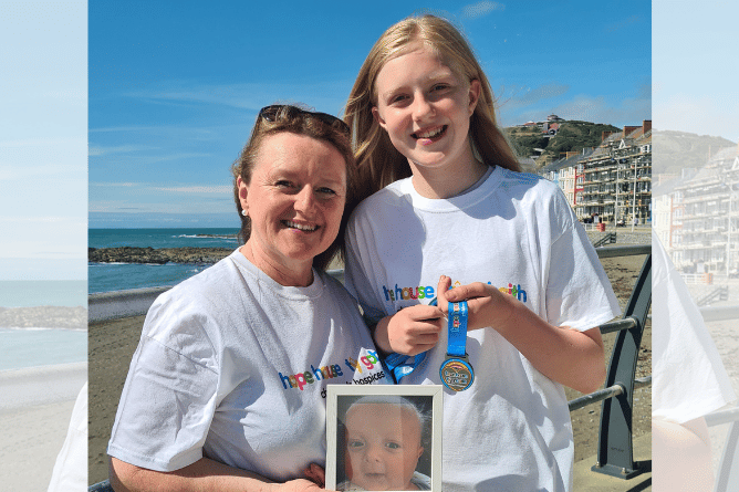 Amanda Trubshaw with her granddaughter, and Archie's cousin, Hazel Phillips, 11 who is holding a medal that walkers will receive at the end