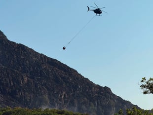 Family pays for own helicopter to tackle mountain fire