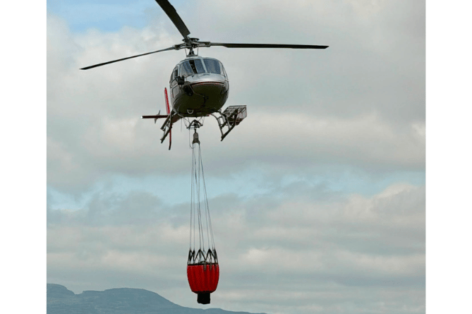 North Wales Fire and Rescue Service receive helicopter support to tackle wildfire
