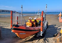 Abersoch RNLI call-out to upturned dinghy and two people in the water