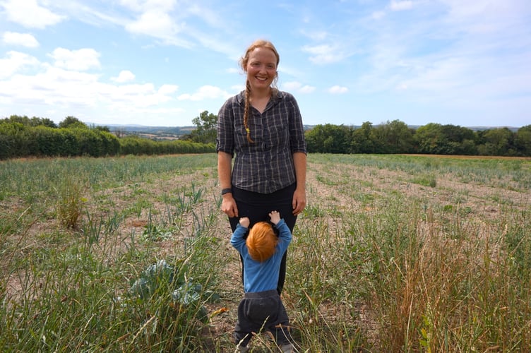 Co-owner of Langton Farm, Katherine Langton with her one-year-old son. Photo: Deb Luxon