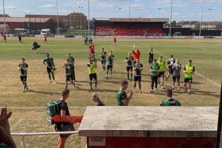 The Aberystwyth players show their appreciation to the travelling support