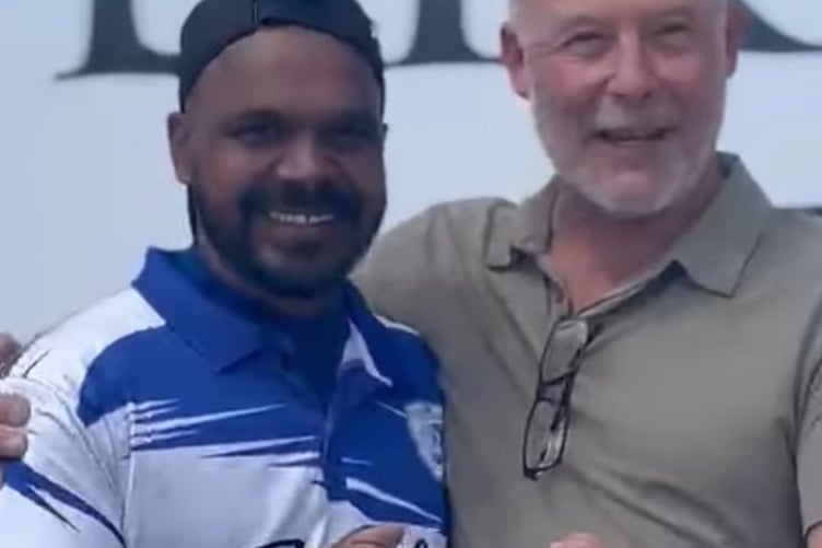 Nigel Salmon presenting the league trophy to Sumesh Antony