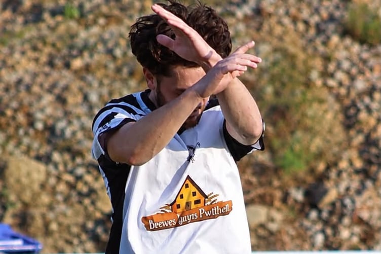 Marcus Banks celebrates after netting Pwllheli's winner