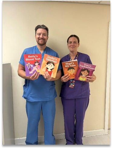 Staff holding the informative books