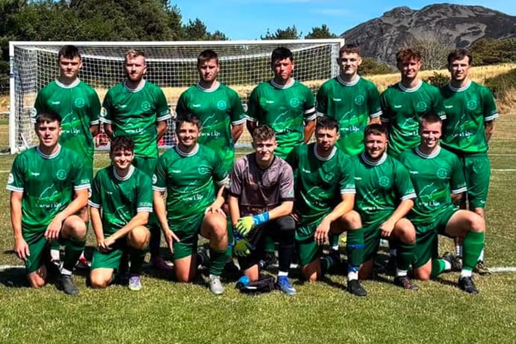 Nefyn in their new away kit sponsored by Cwrw Llŷn, Iwan Adams plastering contractor, and Gerddi a Thiroedd/Gardens and Grounds