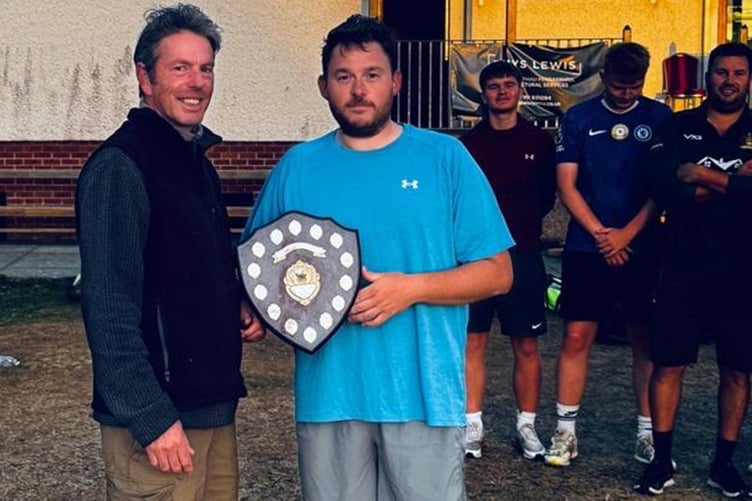 Alex Pitchford presents the plate to Llanfarian captain Graham Saunders
