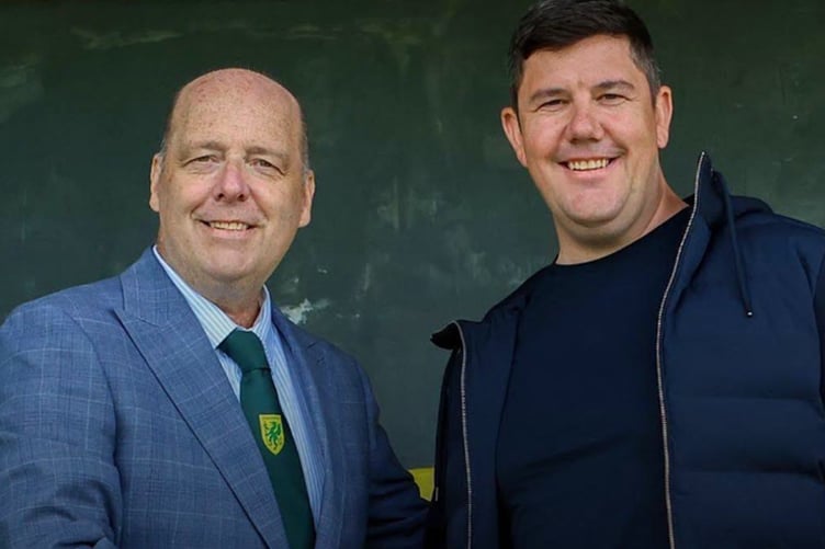 Caernarfon chairman Paul Evans congratulates manager Richard 'Fish' Davies