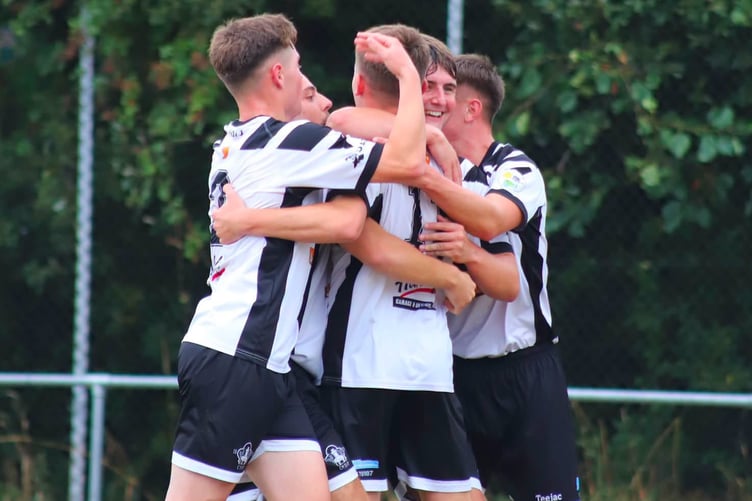 Celebrations after Sion Roberts scored Pwllheli's equaliser