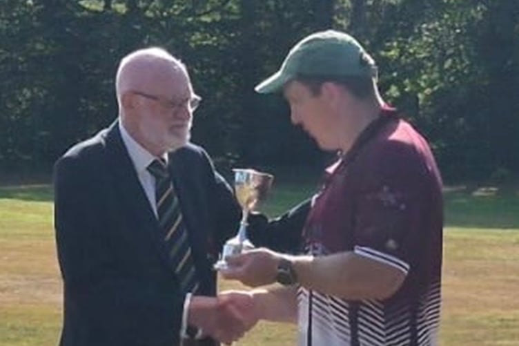 Captain Ceri Thomas receives the trophy