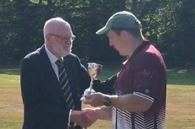 Captain Ceri Thomas receives the trophy