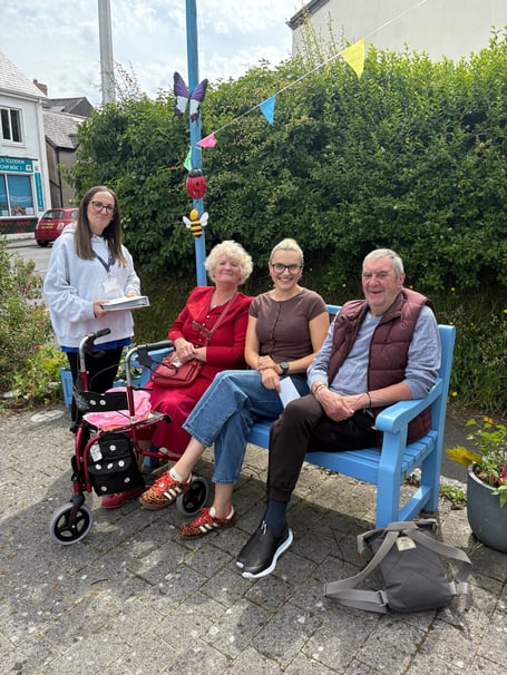 Mr and Mrs Wilkin sat either side of Ffion Evans the Barcud Housing Officer for that area. Nicola Carton from Mind Aberystwyth is standing.