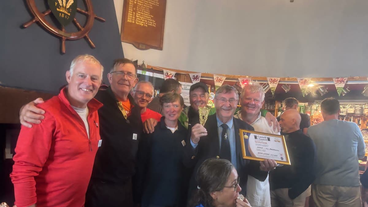 Porthmadog rowers celebrate castle to castle triumph on the Menai Strait
