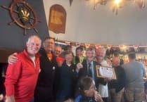 Porthmadog rowers celebrate castle to castle triumph on the Menai Strait