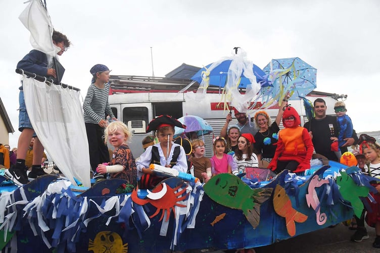 The Dyfi Fest Carnival making its way through Aberdyfi. Photo: Doris O'Keefe