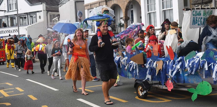 The Dyfi Fest Carnival making its way through Aberdyfi. Photo: Doris O'Keefe