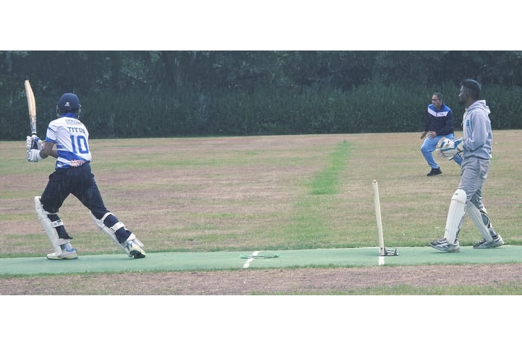 Titus Mathew guides the ball wide of Mo Aslam on his way to his century