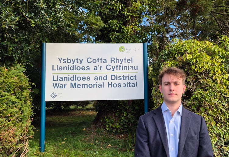 Cllr Glyn Preston in front of Llanidloes hospital