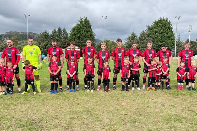 Porthmadog with their mascots before the match against Bala Town