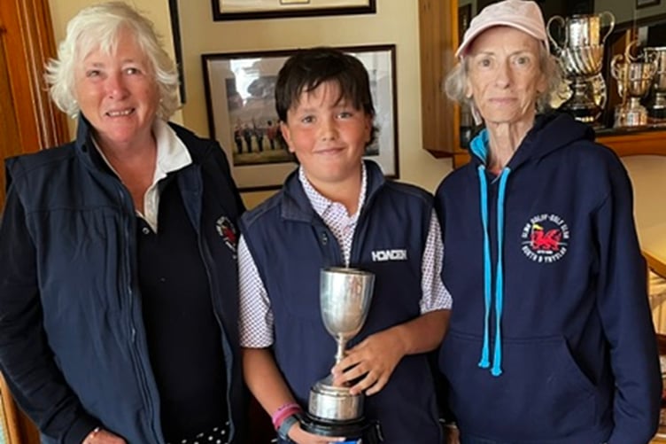Junior champion Tom Troughton with captain Jane Miller and Catherine Maunder