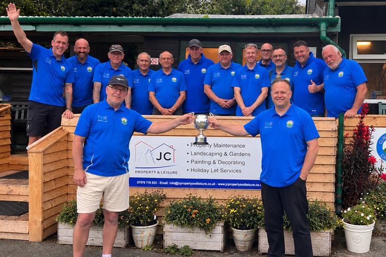 The team with captain Jim Beetham (left) and Dave Jones holding the trophy