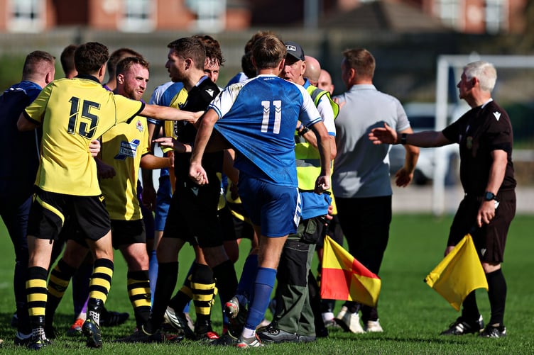 MOLD, FLINTSHIRE, WALES - 12th SEPTEMBER 2026 - Bith teams scuffle after Mold Alexandra vs CPD Llanuwchllyn in Round 8 of the Novira Cymru North at Alyn Park, Mold (Pic by Sam Eaden/FAW)