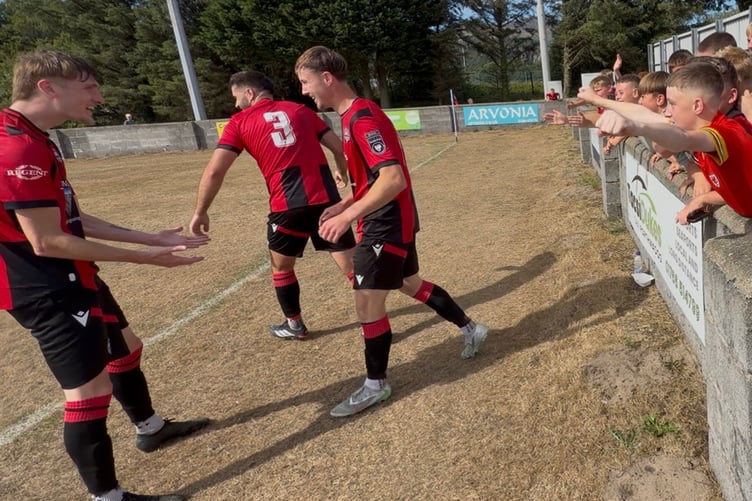 Celebrations after Luke Baum scored the winner for Porthmadog against Rhyl 1879