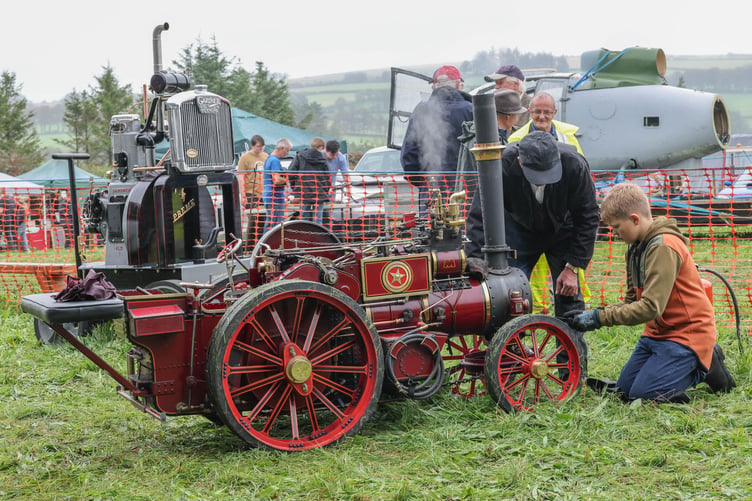 Teaching the young Dai Thomas from Llanfianghel ar Arth with his minature steamer