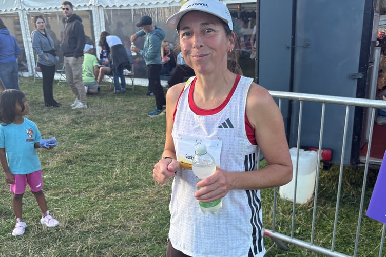 Becky Atkinson celebrates after making history on her Backyard Ultra debut,