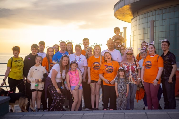 Amanda Trubshaw with family and friends who walked in memory of Archie