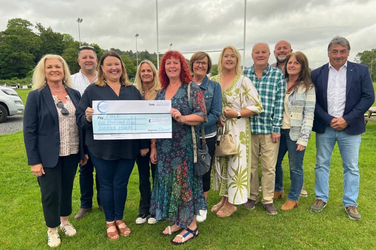 Elinor Powell and Rhian Davies from CBLF (front left) receive a cheque from Jane Gnosill and friends. Photo: Julie McNicholls Vale