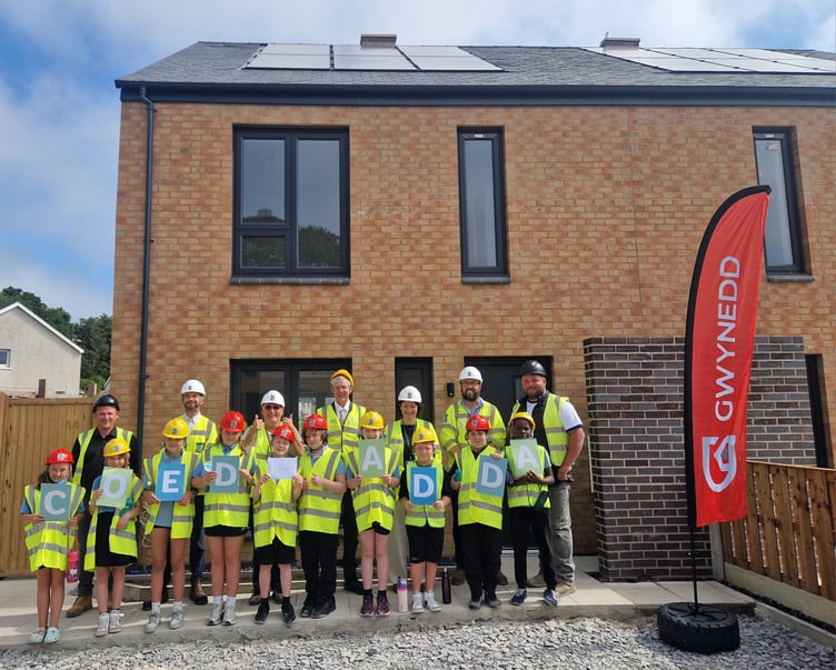 Schoolchildren celebrate naming housing development. Photo: Gwynedd Council