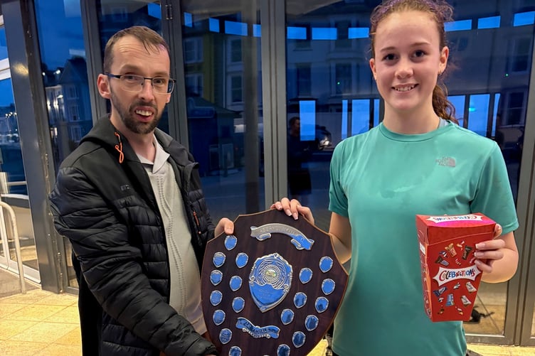 Ian Evans presenting the trophy to Seren Alexander