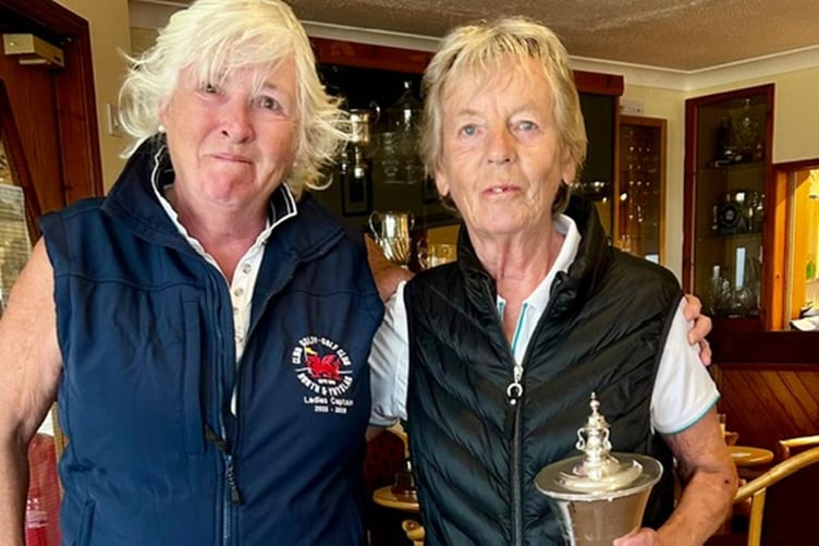 Captain Jane Miller presenting the Clarke Cup to Sue Wilson
