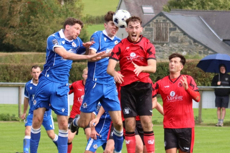 An aerial challenge during Llanuwchllyn's 4-1 win against Penrhyncoch