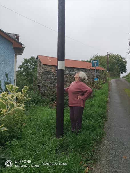 Mick's wife Jenny is pictured with the offending pole placed in the entrance to a farmer's field