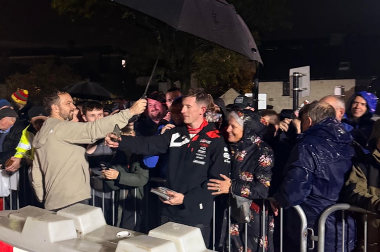 Elfyn Evans takes a selfie with fans