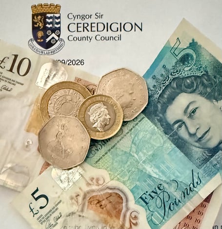 Money on top of a Ceredigion County Council bill