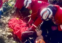 Rescue team help man with injured knee