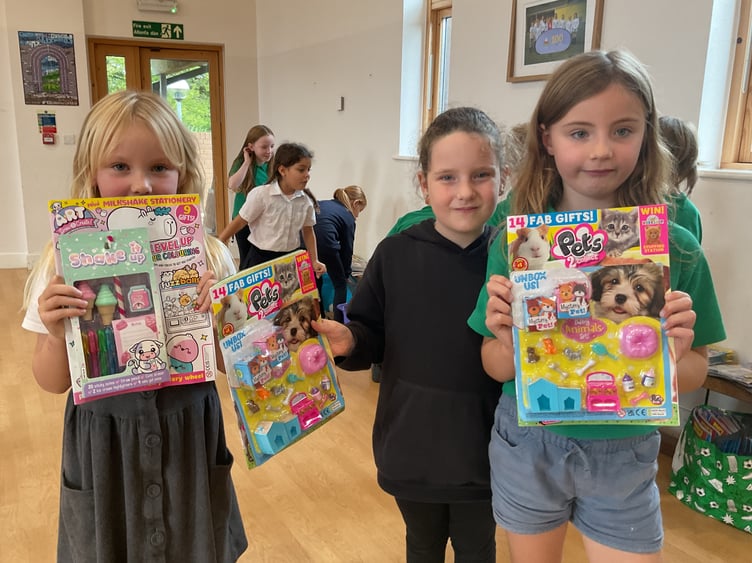 Pupils from Plascrug Primary School with some of the magazines